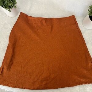 Tan with black dots mini skirt.